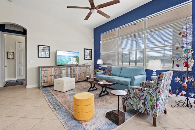 tiled living room featuring ceiling fan