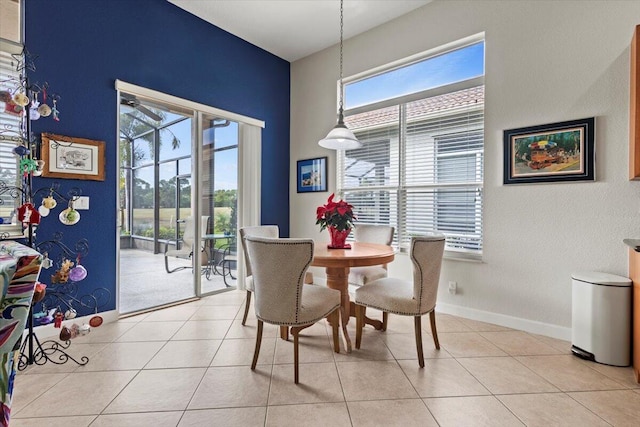 dining area featuring a healthy amount of sunlight and light tile patterned floors