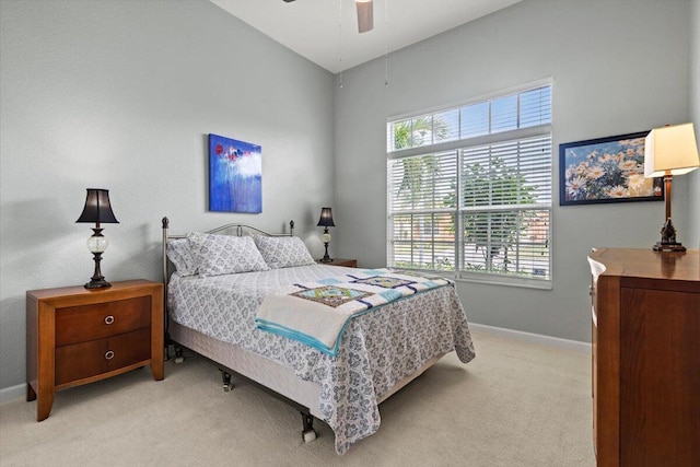 bedroom featuring ceiling fan and light carpet