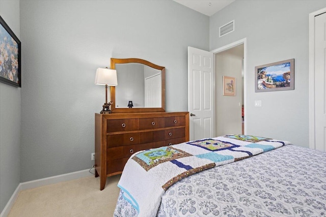 bedroom with light colored carpet