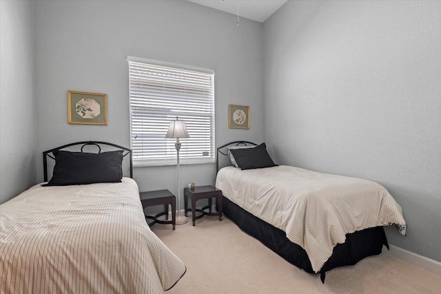 bedroom with light colored carpet