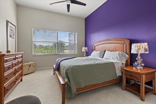 bedroom featuring ceiling fan and light colored carpet