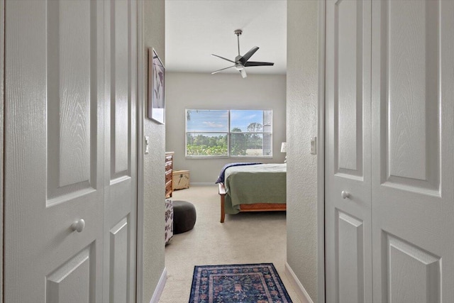 carpeted bedroom featuring ceiling fan