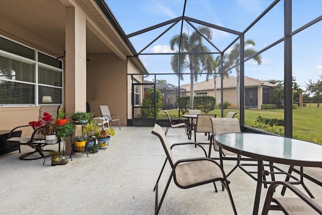 view of patio with glass enclosure