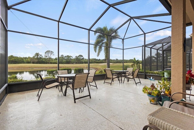 sunroom with a healthy amount of sunlight and a water view