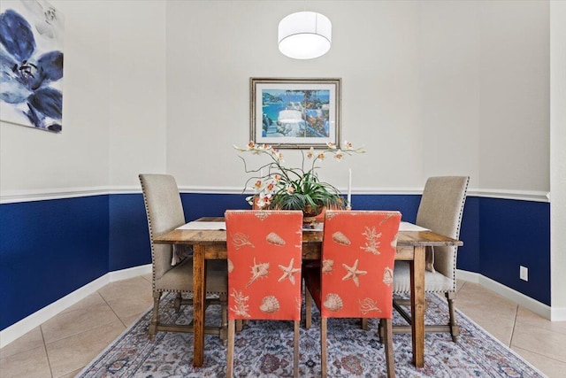 dining space with tile patterned flooring