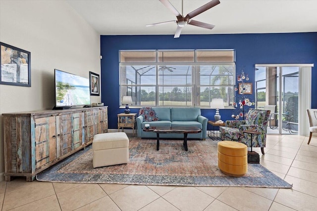 tiled living room with ceiling fan and a healthy amount of sunlight