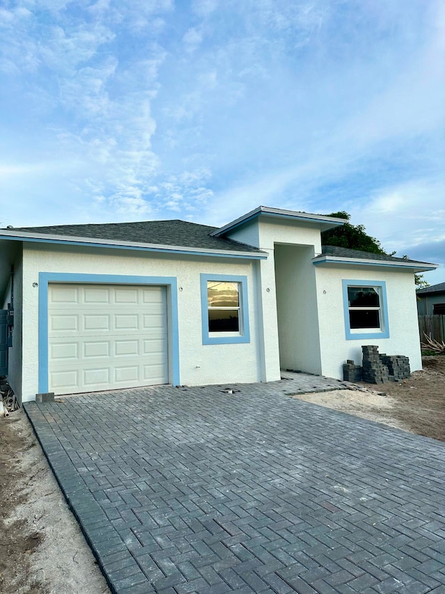 view of front of property with a garage