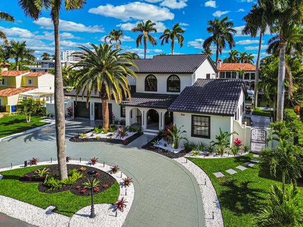 mediterranean / spanish-style home with a front lawn