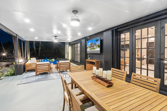 dining room with concrete flooring and ceiling fan