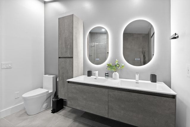 bathroom featuring tile patterned floors, vanity, toilet, and a shower