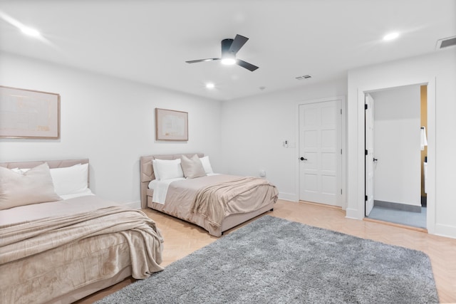 bedroom with ceiling fan and light parquet flooring