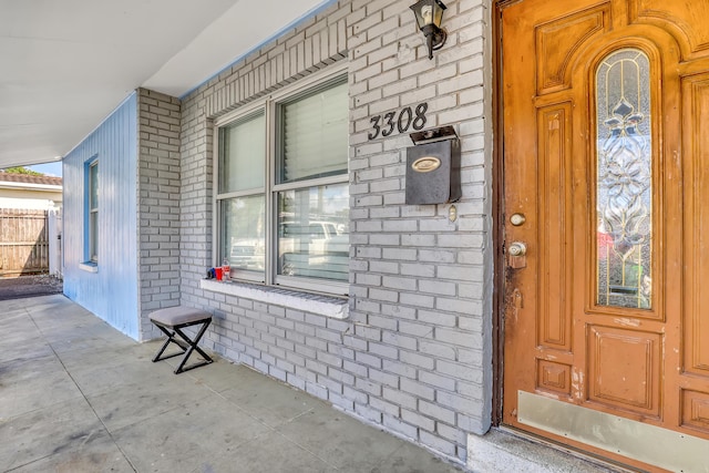 doorway to property featuring covered porch