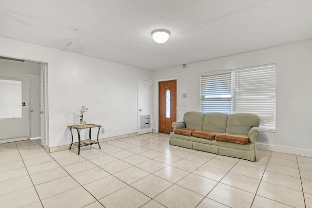 tiled living room with a textured ceiling