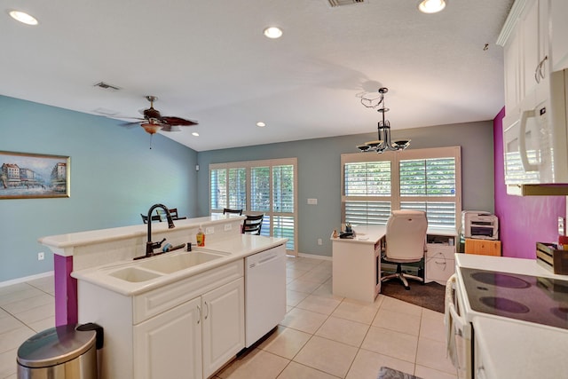 kitchen with white cabinetry, sink, hanging light fixtures, white appliances, and a kitchen island with sink