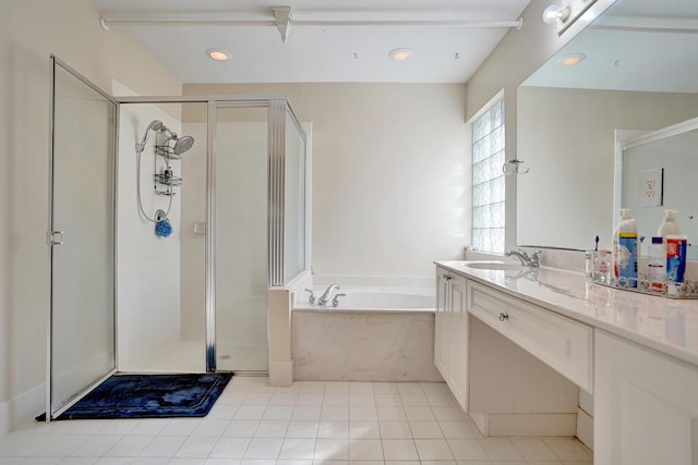 bathroom featuring tile patterned flooring, vanity, and separate shower and tub