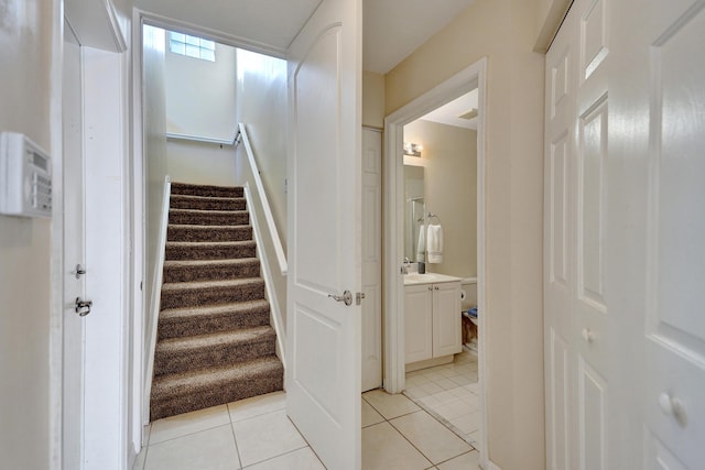 staircase with tile patterned flooring