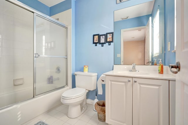 full bathroom with combined bath / shower with glass door, tile patterned floors, vanity, and toilet