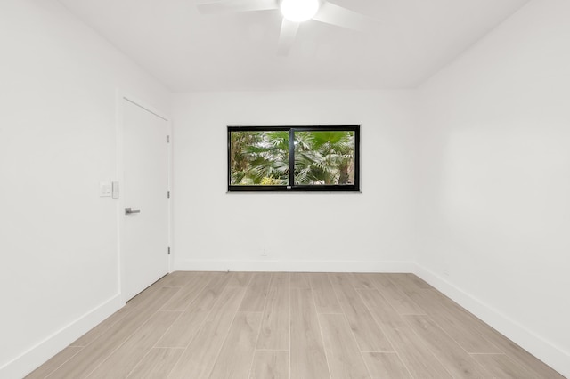 spare room featuring ceiling fan and light hardwood / wood-style floors