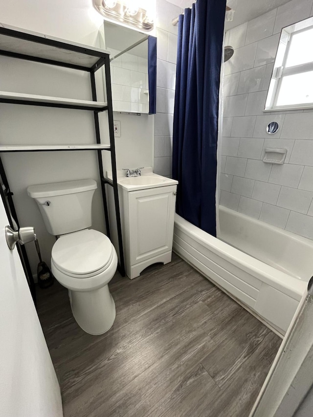 full bathroom featuring shower / bathtub combination with curtain, vanity, toilet, and wood-type flooring