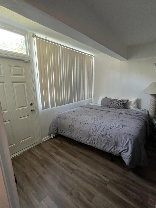 bedroom featuring dark hardwood / wood-style floors