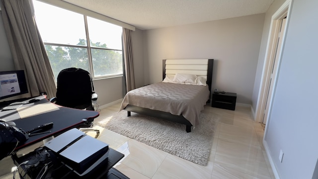 bedroom featuring a textured ceiling