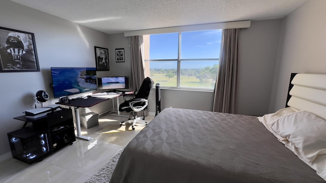 tiled bedroom with a textured ceiling