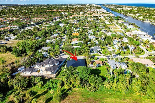 birds eye view of property with a water view