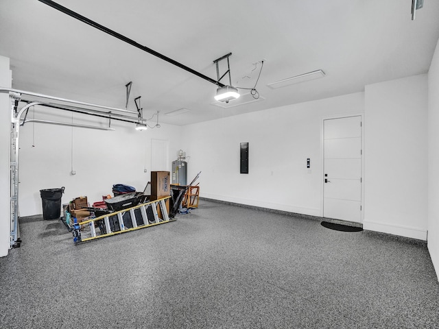 garage featuring electric panel and a garage door opener