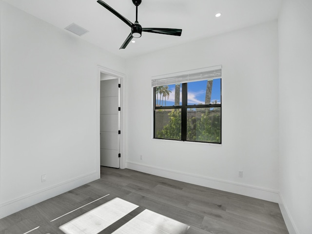 empty room featuring hardwood / wood-style flooring and ceiling fan