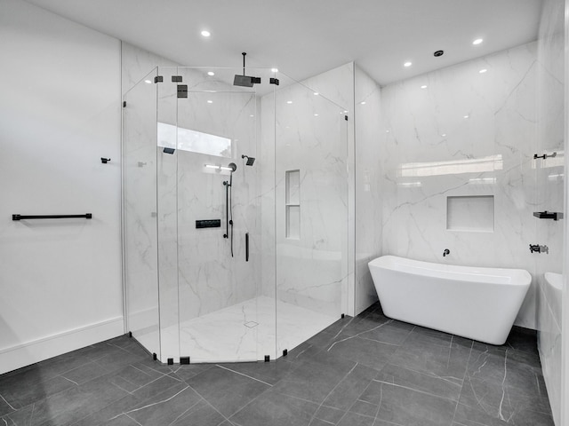 bathroom featuring separate shower and tub