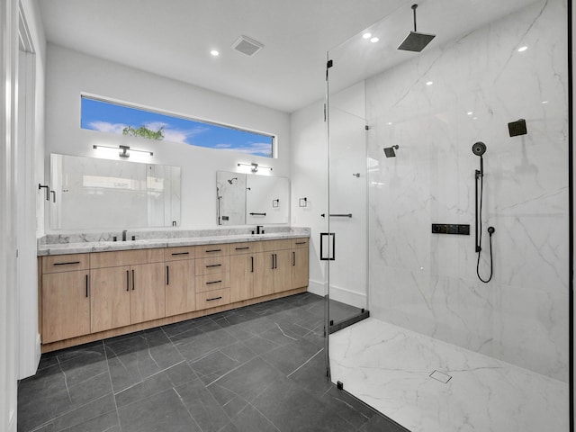 bathroom featuring vanity and a shower with door