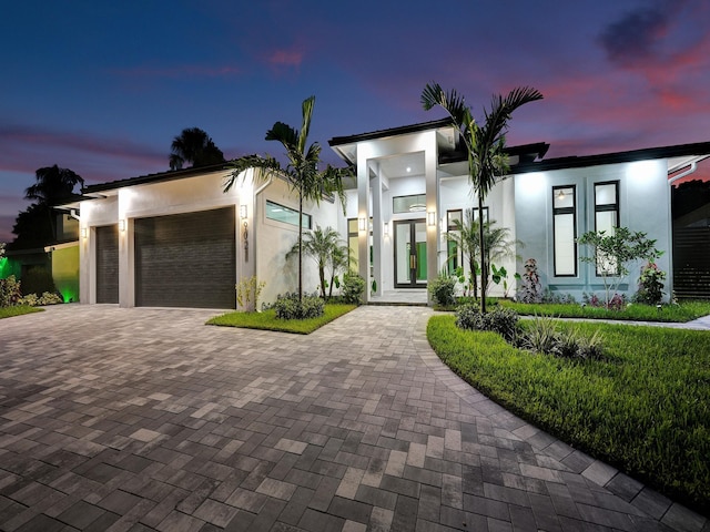 modern home featuring a garage and french doors