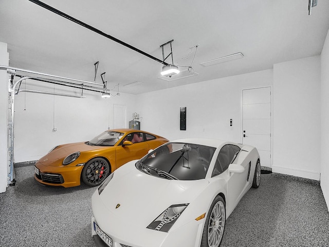 garage featuring electric panel and a garage door opener