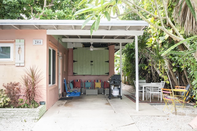 view of patio with ceiling fan and a grill