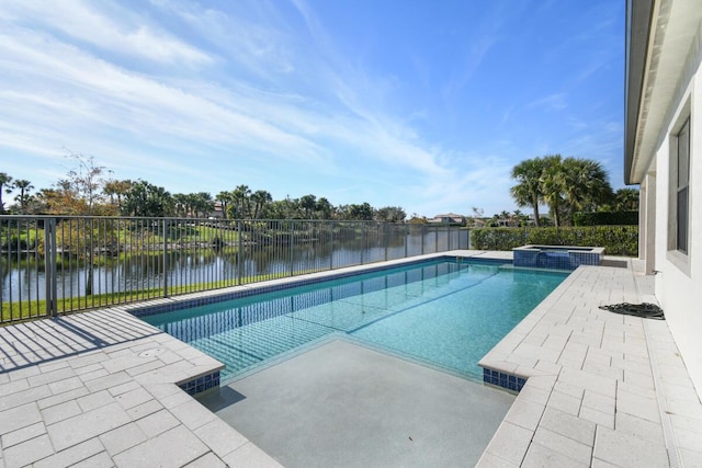 view of swimming pool with a water view, an in ground hot tub, and a patio