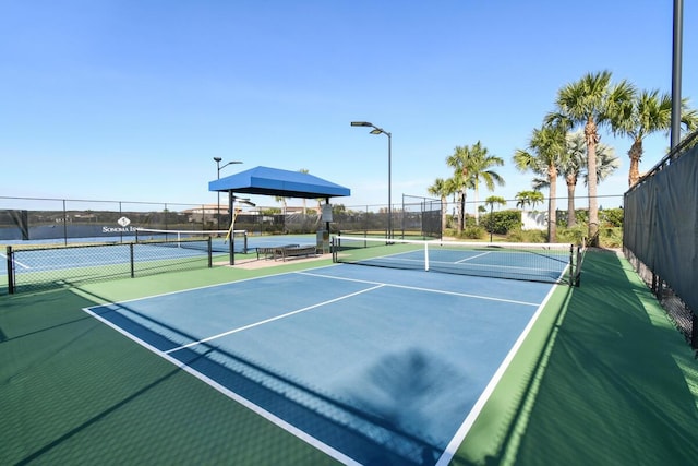 view of sport court featuring basketball hoop