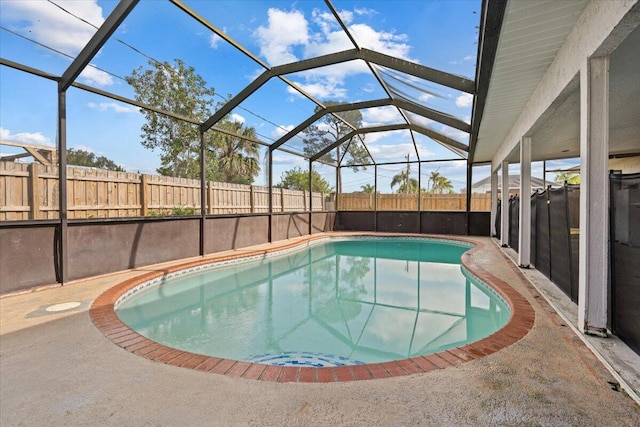 view of swimming pool featuring a lanai, a fenced backyard, a fenced in pool, and a patio