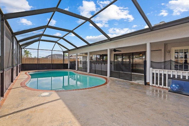 view of swimming pool with a fenced in pool, a patio, a lanai, and fence