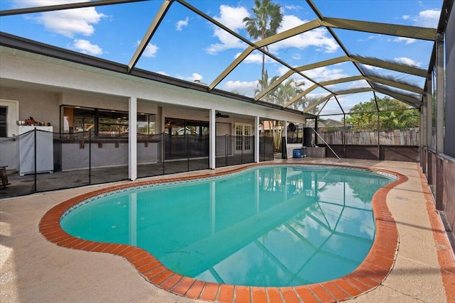 view of swimming pool featuring a lanai, a fenced in pool, and a patio