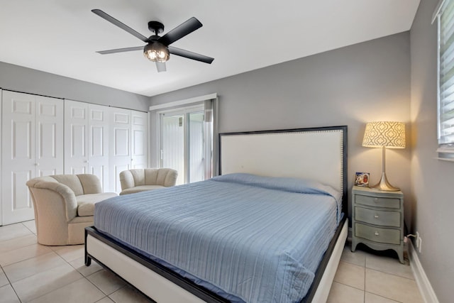 bedroom with ceiling fan and light tile patterned flooring