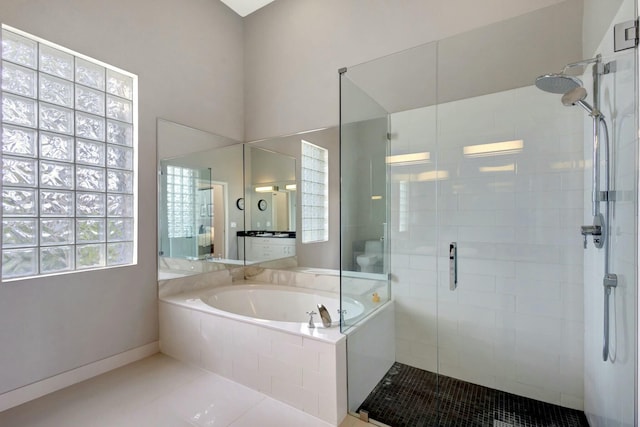 bathroom featuring tile patterned floors and plus walk in shower