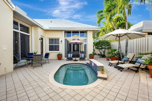 rear view of property with a patio area