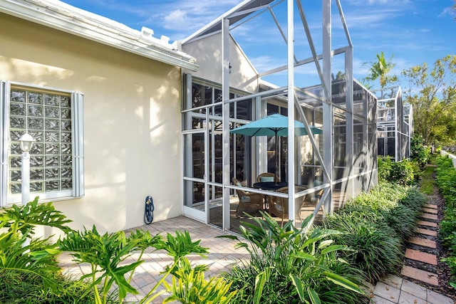 exterior space featuring a lanai and a patio area