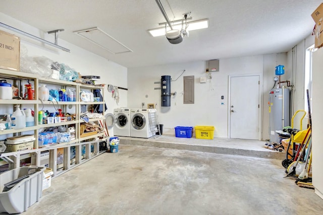 garage featuring electric panel, a garage door opener, washer and clothes dryer, and water heater