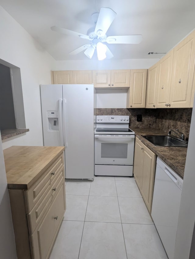 kitchen with white appliances, decorative backsplash, sink, ceiling fan, and light tile patterned floors