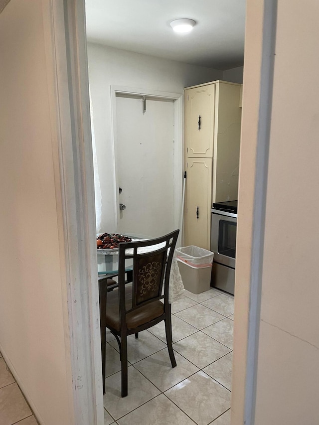 dining area with light tile patterned floors