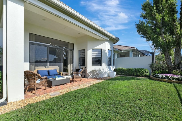 exterior space featuring a yard, a patio, and an outdoor hangout area