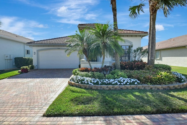 mediterranean / spanish-style home featuring a garage