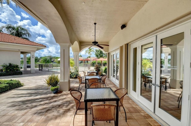 view of patio with ceiling fan and french doors